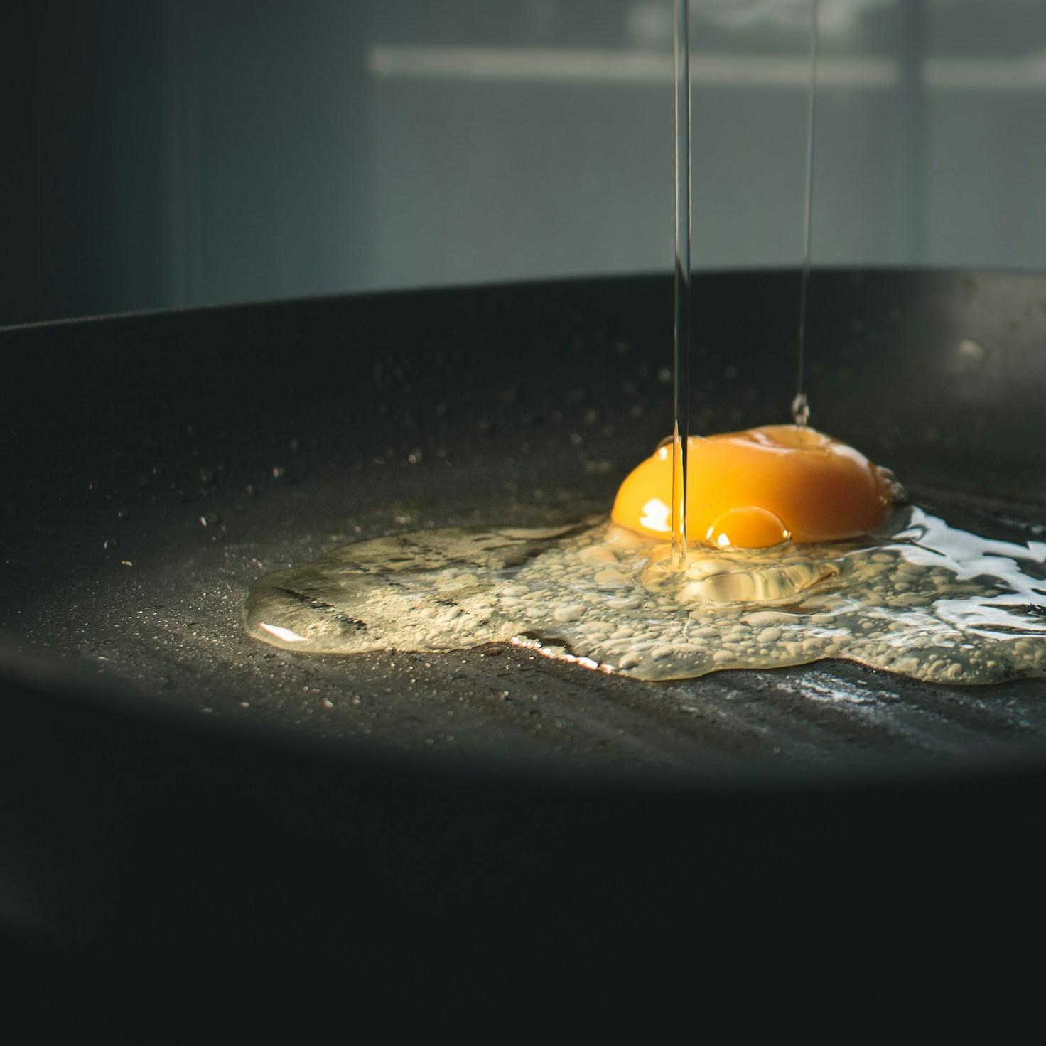 Community members collaborating in a contemporary kitchen space, exchanging recipes and techniques